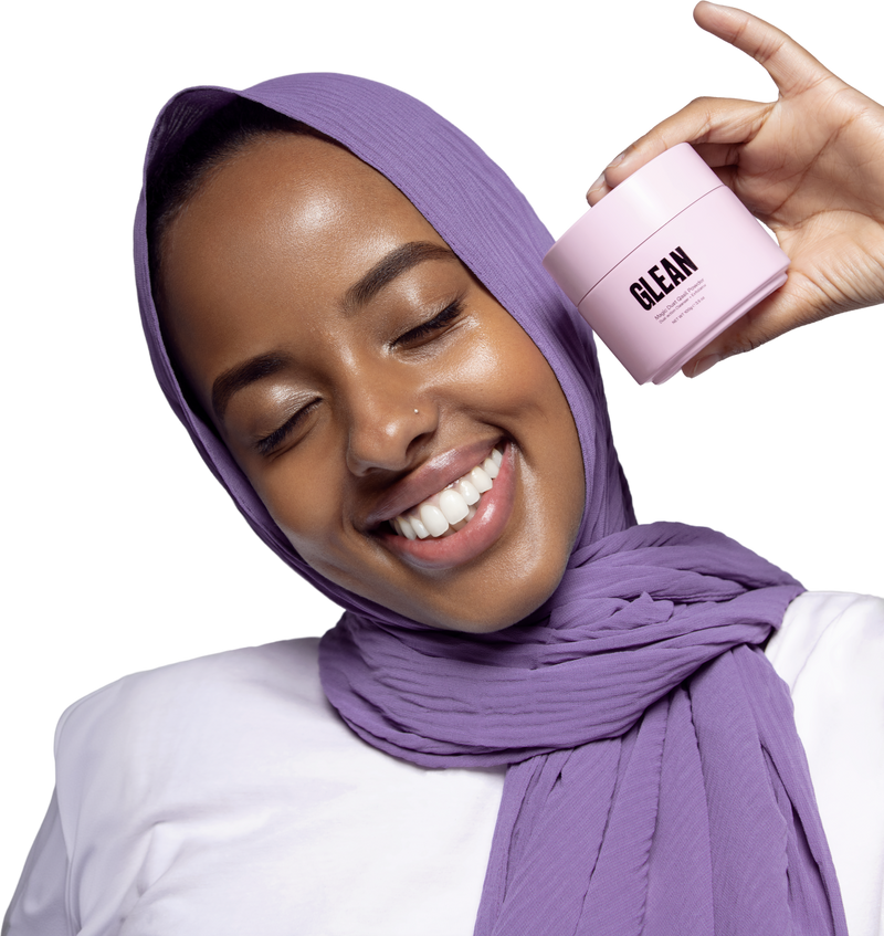 Smiling woman holding a Glean jar